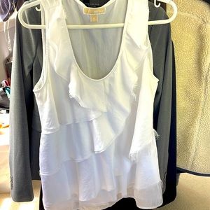 Woman’s white sleeveless blouse